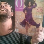Tony Eason holding Oprah Winfrey Magazine