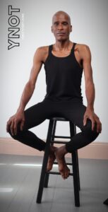 San Francisco Yoga Teacher, Tony Eason sitting in yoga studio