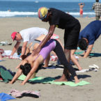 Yoga Teacher Tony Eason gives adjustment