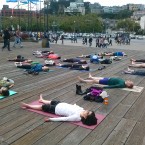 Yoga Students in Savasana. Pier 39 San Francisco.